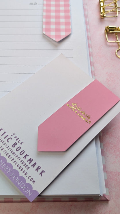 Pink checkered bookmarks with gold text on a white background